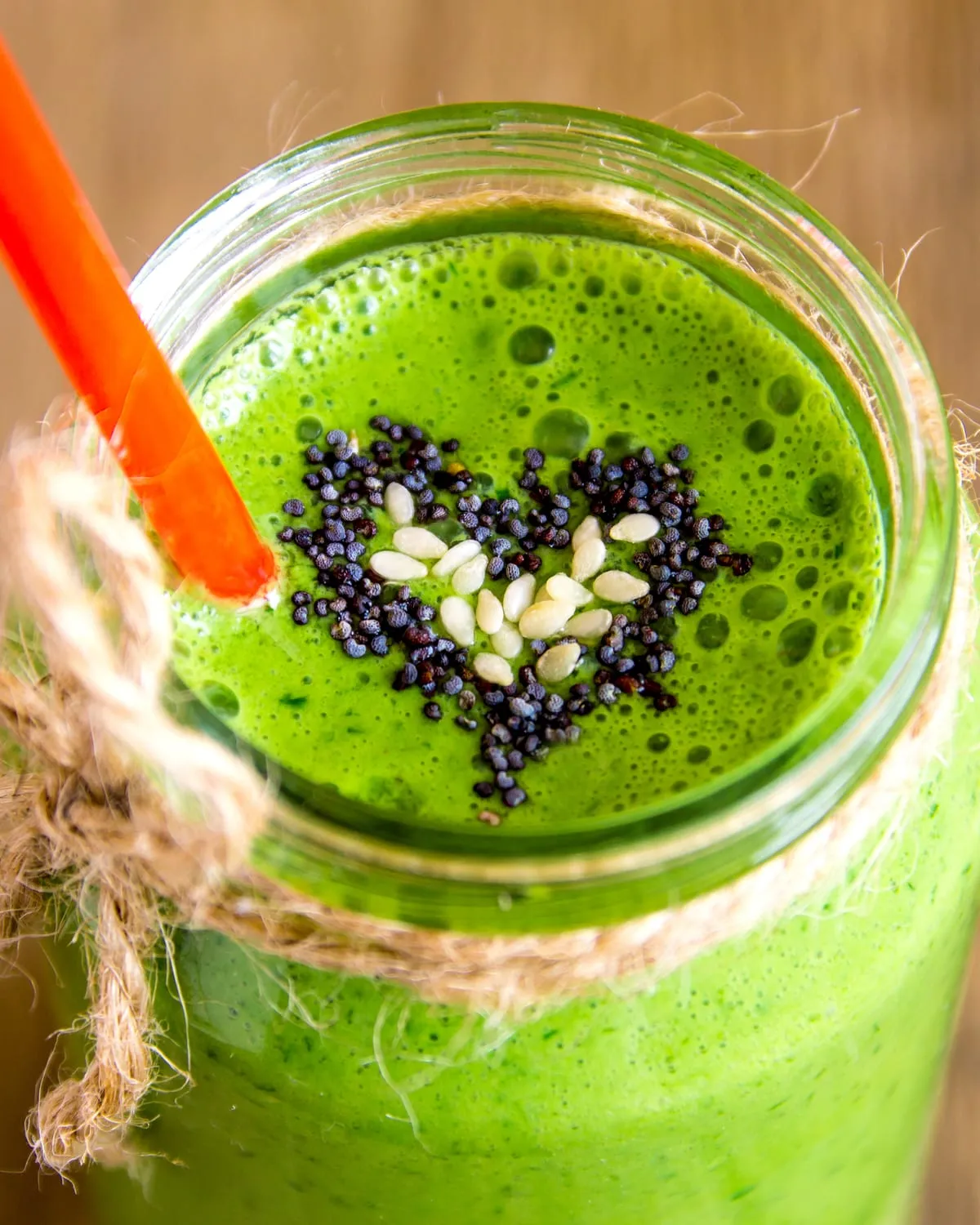 Green smoothie with a heart drawn in chia seeds